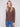 Mocha sweater in textured fabric paired with blue jeans, offering a cozy yet stylish look by Charlie B.