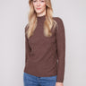 Mocha sweater in textured fabric paired with blue jeans, offering a cozy yet stylish look by Charlie B.