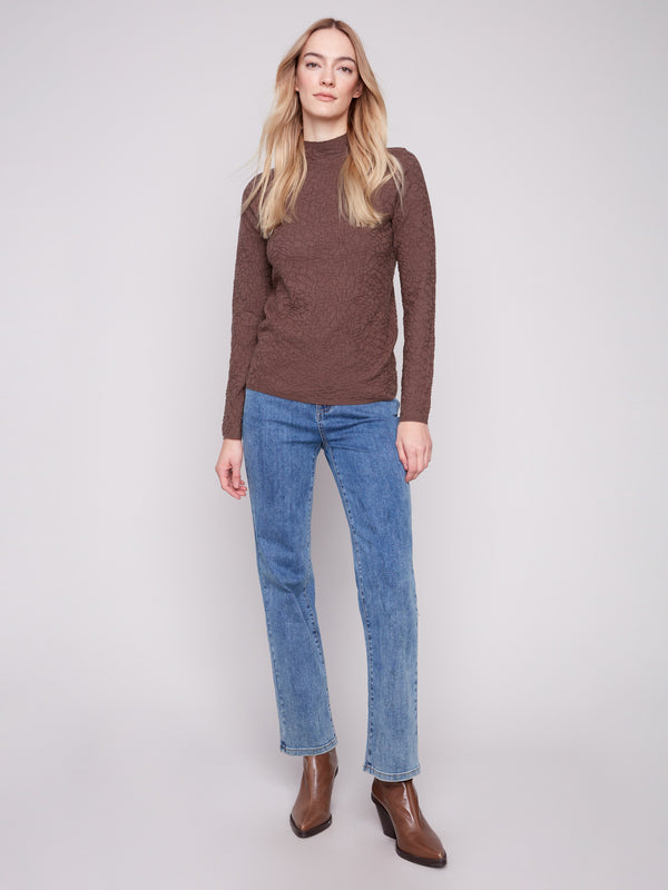 Mocha long-sleeve sweater featuring a slim fit, matched with blue jeans for an elegant outfit by Charlie B.