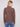 Textured mocha sweater styled with classic blue jeans, showcasing a chic and modern design by Charlie B.