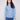 Oxford blue sweater with a slim fit, paired with blue jeans for a sleek look by Charlie B.