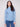 Oxford blue sweater with a slim fit, paired with blue jeans for a sleek look by Charlie B.