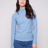Oxford blue sweater with a slim fit, paired with blue jeans for a sleek look by Charlie B.