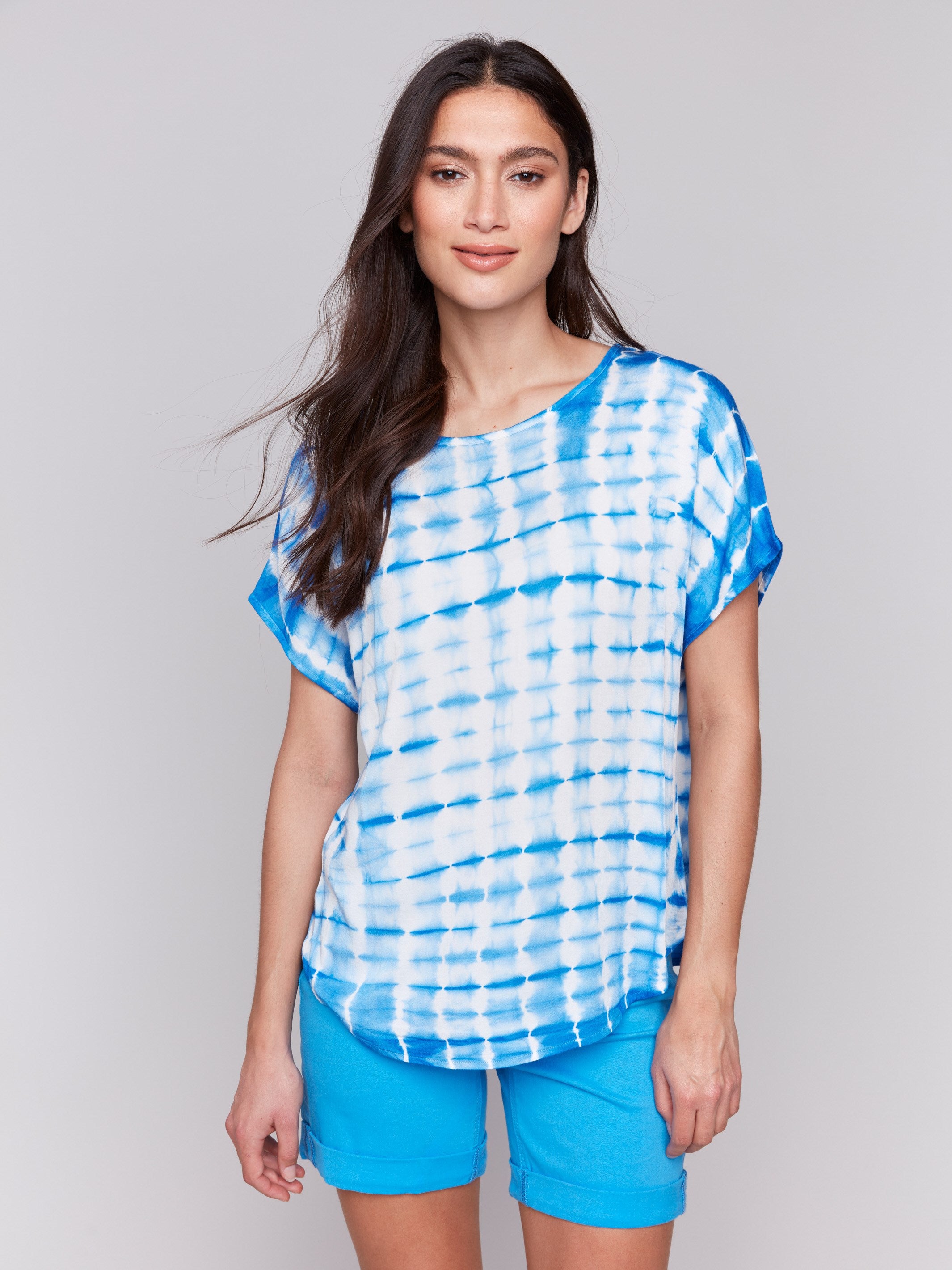 Azure Dolman top featuring a crew neck and artistic tie-dye design by Charlie B.