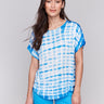 Azure Dolman top featuring a crew neck and artistic tie-dye design by Charlie B.