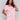 Pink and orange dolman top with a round neckline by Charlie B.