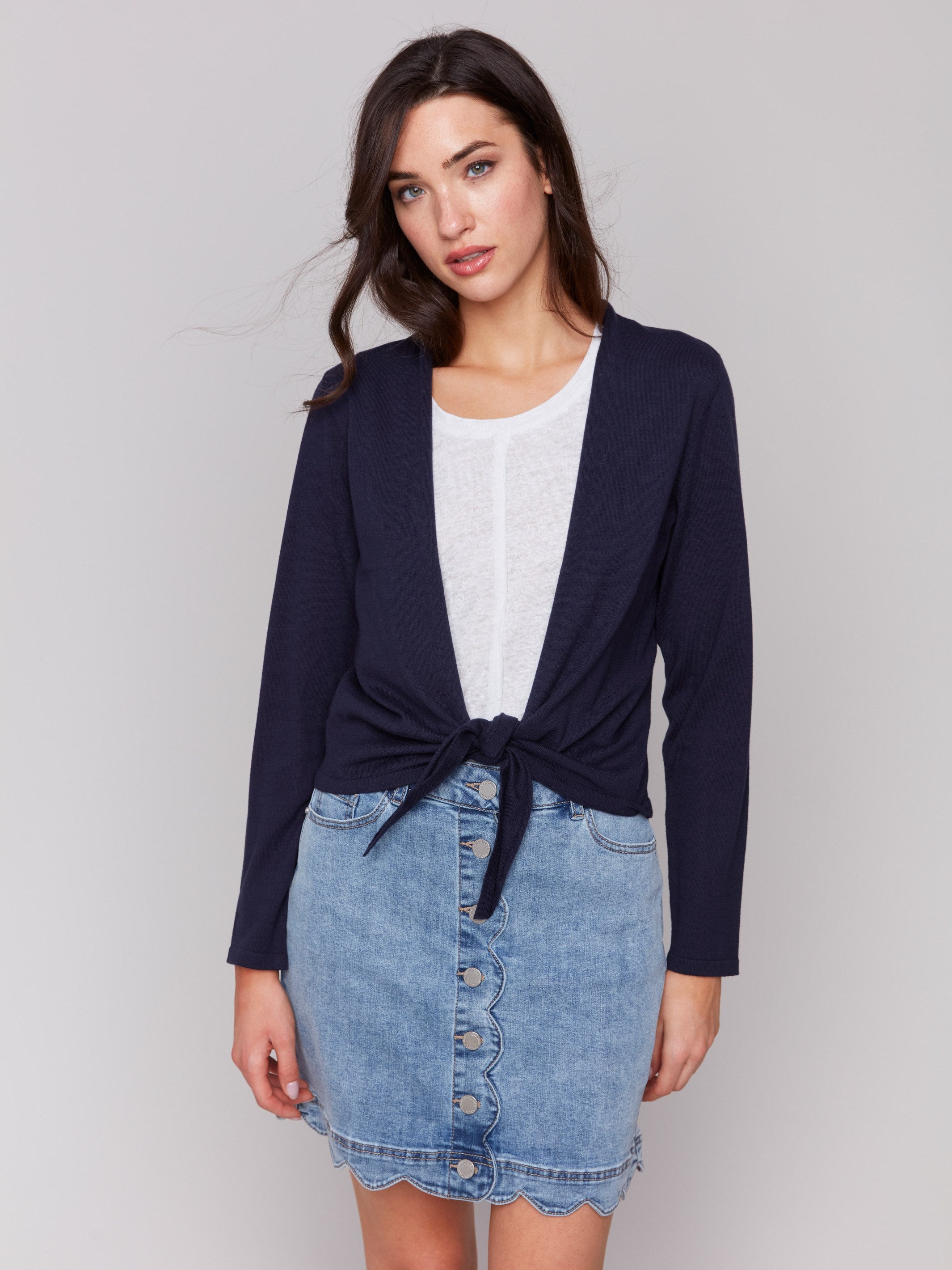 Navy bolero featuring a shawl neckline by Charlie B.