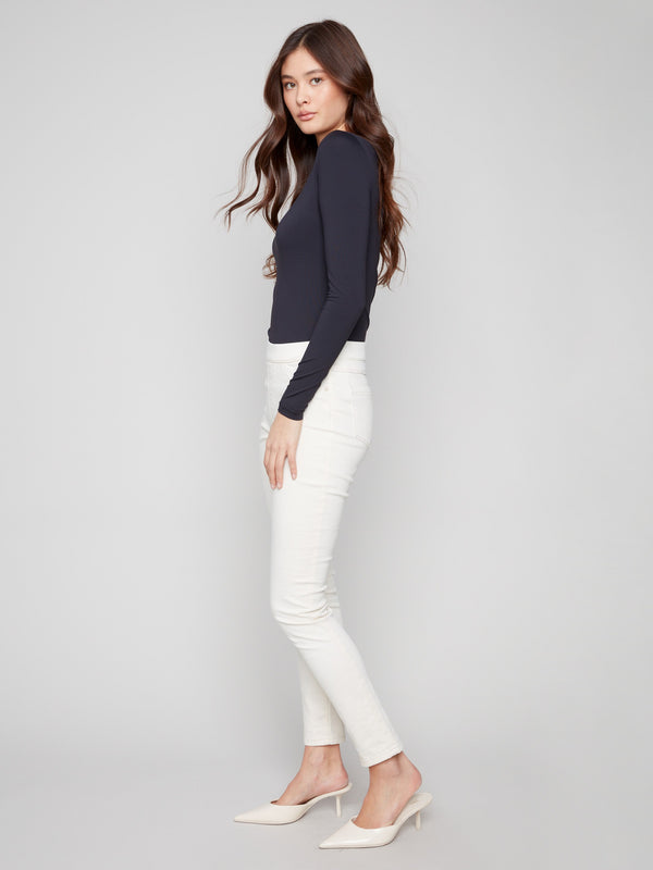 Slim-fit natural twill pants with regular rise and stretchy comfort, featuring a simple pull-on design by Charlie B.