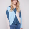 Heather Denim argyle sweater with a V-neck, showcasing an elegant long sleeve style by Charlie B.