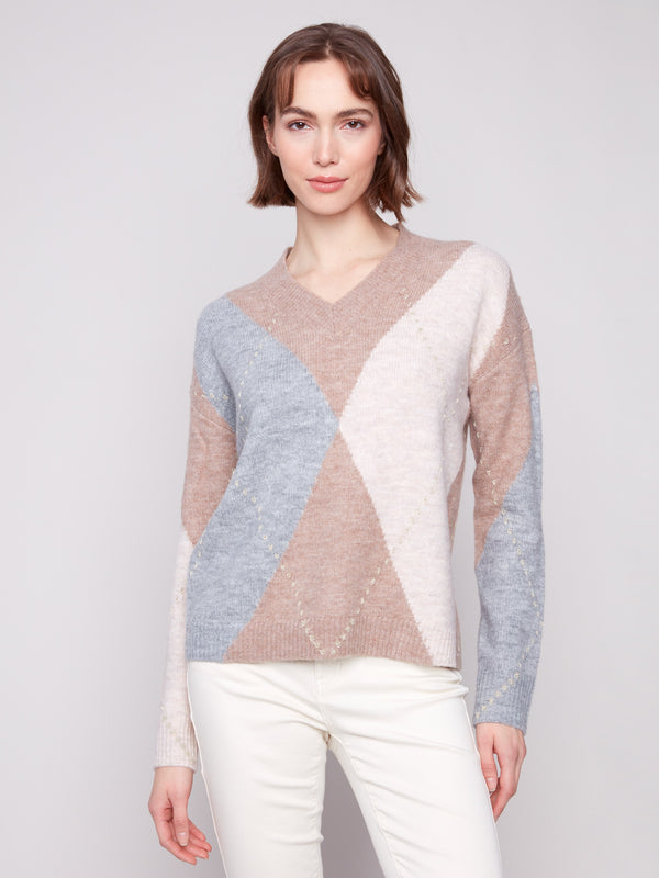 Heather Sesame argyle sweater showcasing the elegant V-neck design, perfect for a chic and cozy look by Charlie B.