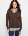 Brown sweater featuring a striped poplin shirt collar, paired with jeans, by Charlie B.