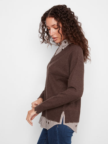 Sweater with embroidered hearts on the hem, styled casually with jeans, by Charlie B.