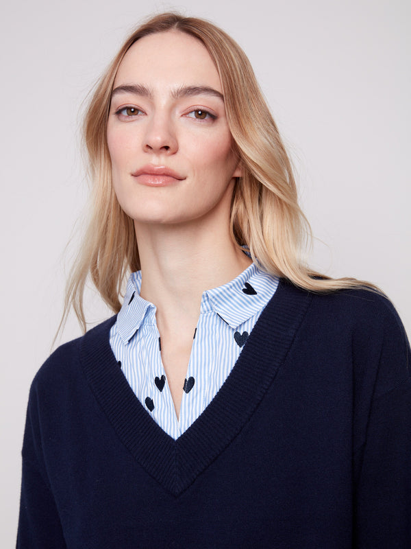 Elegant navy sweater showcasing an embroidered poplin shirt collar with heart details for added charm by Charlie B.
