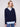 Navy V-neck sweater featuring long sleeves and an embroidered collar with heart motifs for added charm by Charlie B.