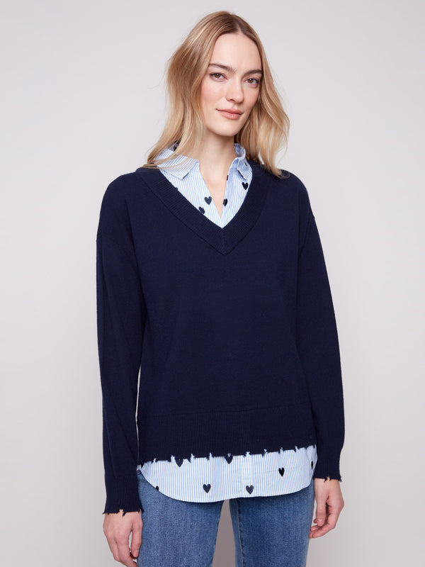 Navy V-neck sweater featuring long sleeves and an embroidered collar with heart motifs for added charm by Charlie B.