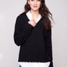Black sweater featuring long sleeves and a layered design, paired with a faux shirt collar by Charlie B.