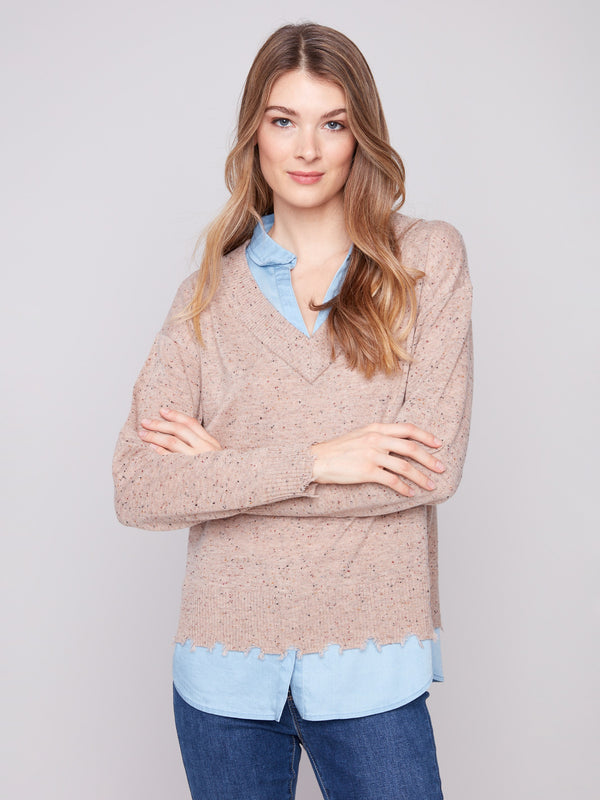 Elegant oat flecks sweater showcasing a frayed finish at cuffs and hem, adding a trendy touch by Charlie B.