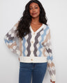 Geometric jacquard cardigan with a stylish V-neck and ribbed cuffs, offering a chic look by Charlie B.