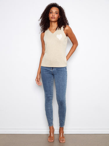Stylish V-neck cami in gold with a lovely white heart detail for added charm by Charlie B.