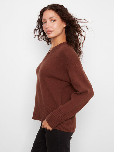 This sweater showcases a stylish drop shoulder design, adding a relaxed touch to your outfit. By Charlie B.
