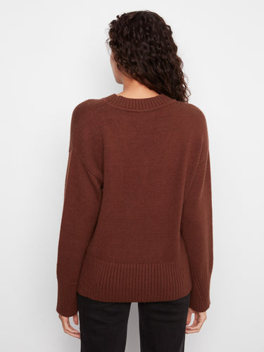 The versatile fit of this sweater makes it an essential piece for any wardrobe update. By Charlie B.