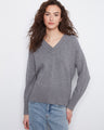 Grey knit sweater featuring a V-neckline and long sleeves, crafted with ribbed details by Charlie B.