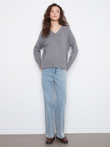 Classic V-neck grey knit sweater, designed with long sleeves and unique ribbing details by Charlie B.