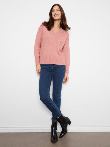 Cozy pink sweater featuring a drop shoulder design, adding a relaxed and comfortable fit to your wardrobe essentials. By Charlie B.