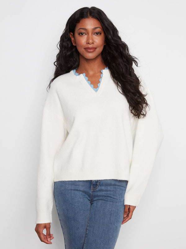 Sweater featuring a V-notch neckline with woven trim, offering a stylish touch to any casual outfit by Charlie B.
