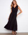 Black sleeveless dress with a flattering V-neckline and elegant tiered design, perfect for any occasion by Charlie B.