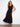 Black sleeveless dress with a flattering V-neckline and elegant tiered design, perfect for any occasion by Charlie B.