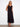 Elegant maxi length black dress showcasing a graceful tiered design that adds movement and charm to the outfit by Charlie B.
