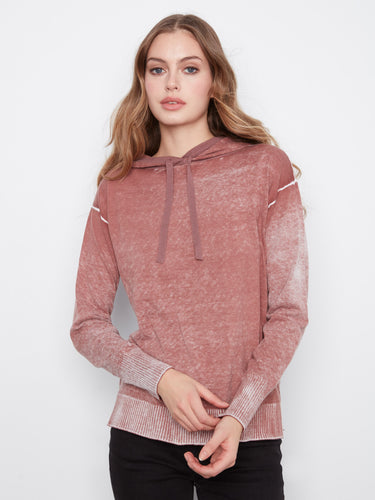 This hoodie features a washed effect, adding a unique texture and style to your look by Charlie B.