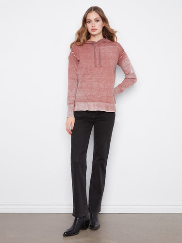 Crafted with long sleeves, this hoodie ensures warmth and comfort for cooler days by Charlie B.