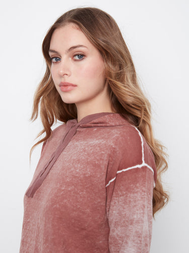 The hood is equipped with a drawstring for adjustable coverage and added style by Charlie B.
