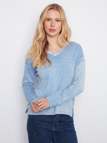 This cotton-blend knit top features a stylish V-neckline, offering both comfort and elegance for any casual outing by Charlie B.