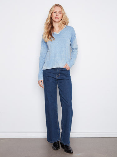 The long sleeves of this top provide warmth and style, making it perfect for cooler weather while maintaining a chic look by Charlie B.