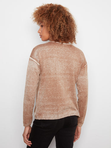 Showcasing a unique washed finish, this sweater brings an effortlessly chic vibe to your wardrobe. By Charlie B.