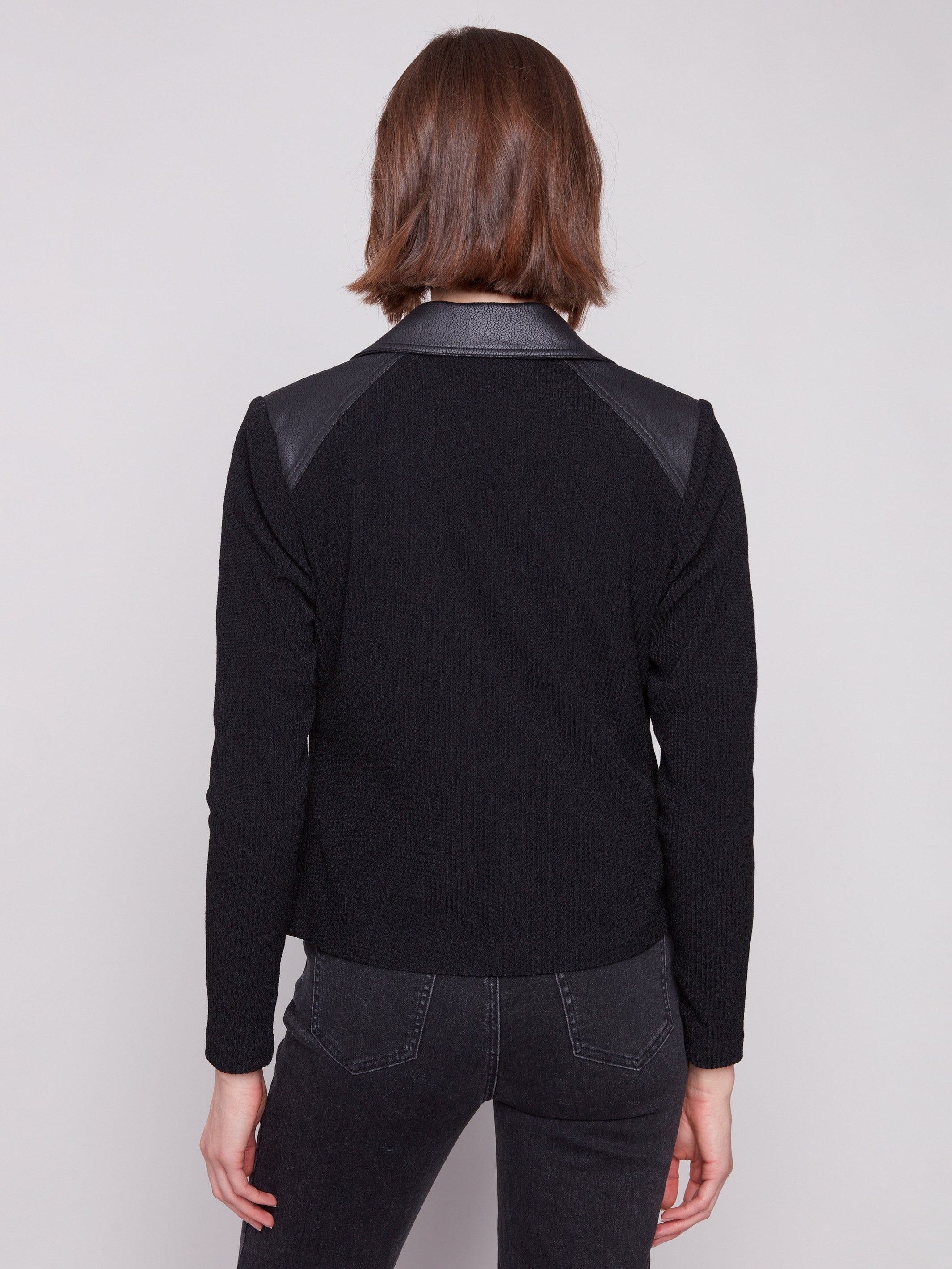 Black jacket crafted from luxurious faux leather texture, offering sophistication by Charlie B.