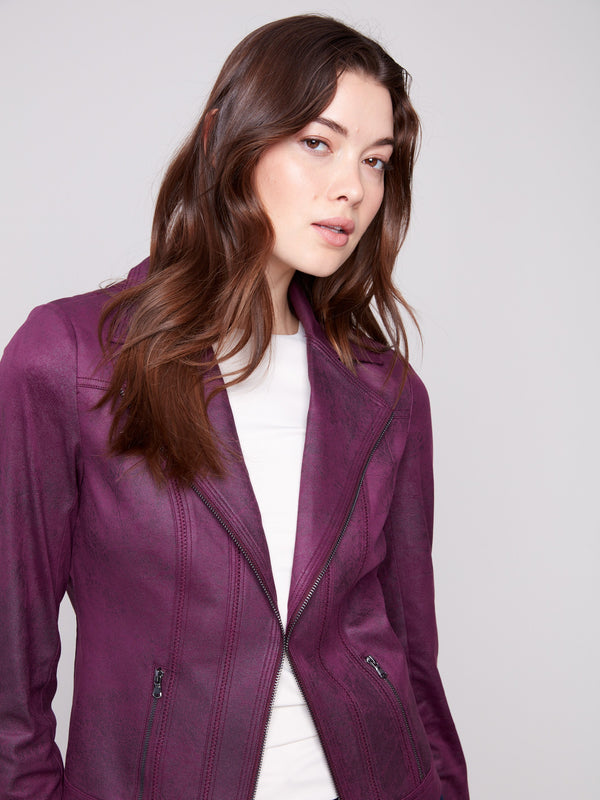 Stylish berry faux leather jacket showcasing sophisticated zipper details and lapel collar by Charlie B.