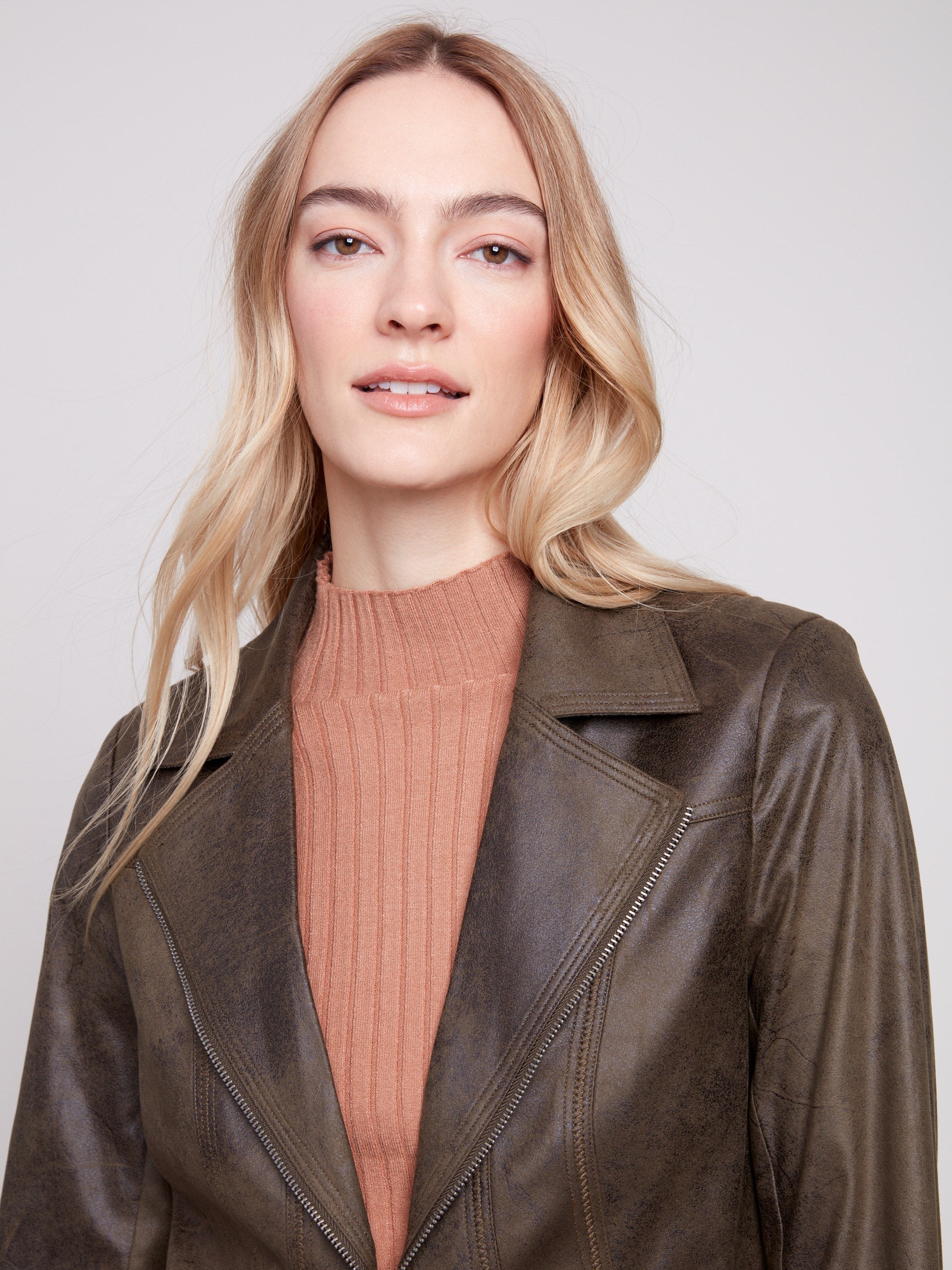 Chic spruce faux leather jacket showcasing modern zipper accents by Charlie B.
