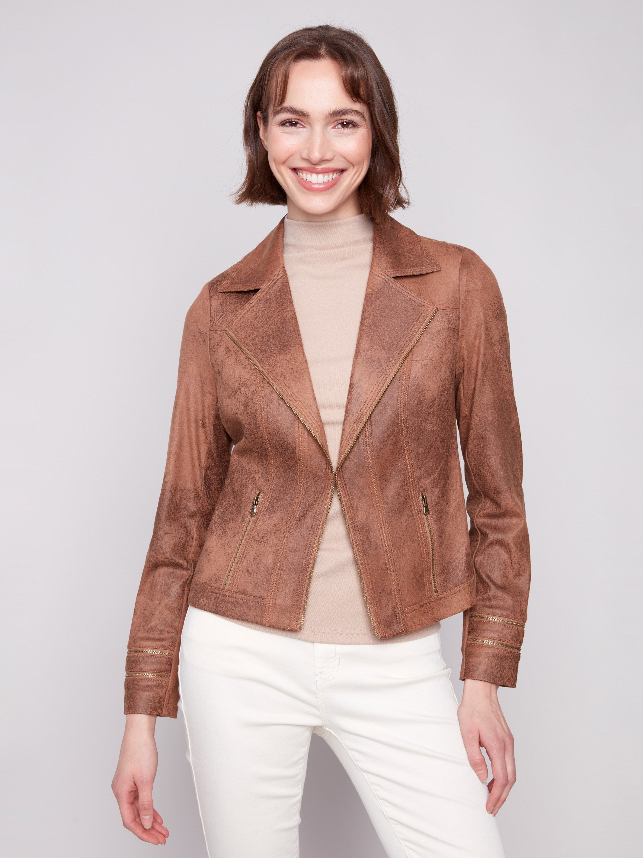 Truffle faux leather jacket showcasing elegant zipper accents and a chic lapel collar, crafted for style by Charlie B.