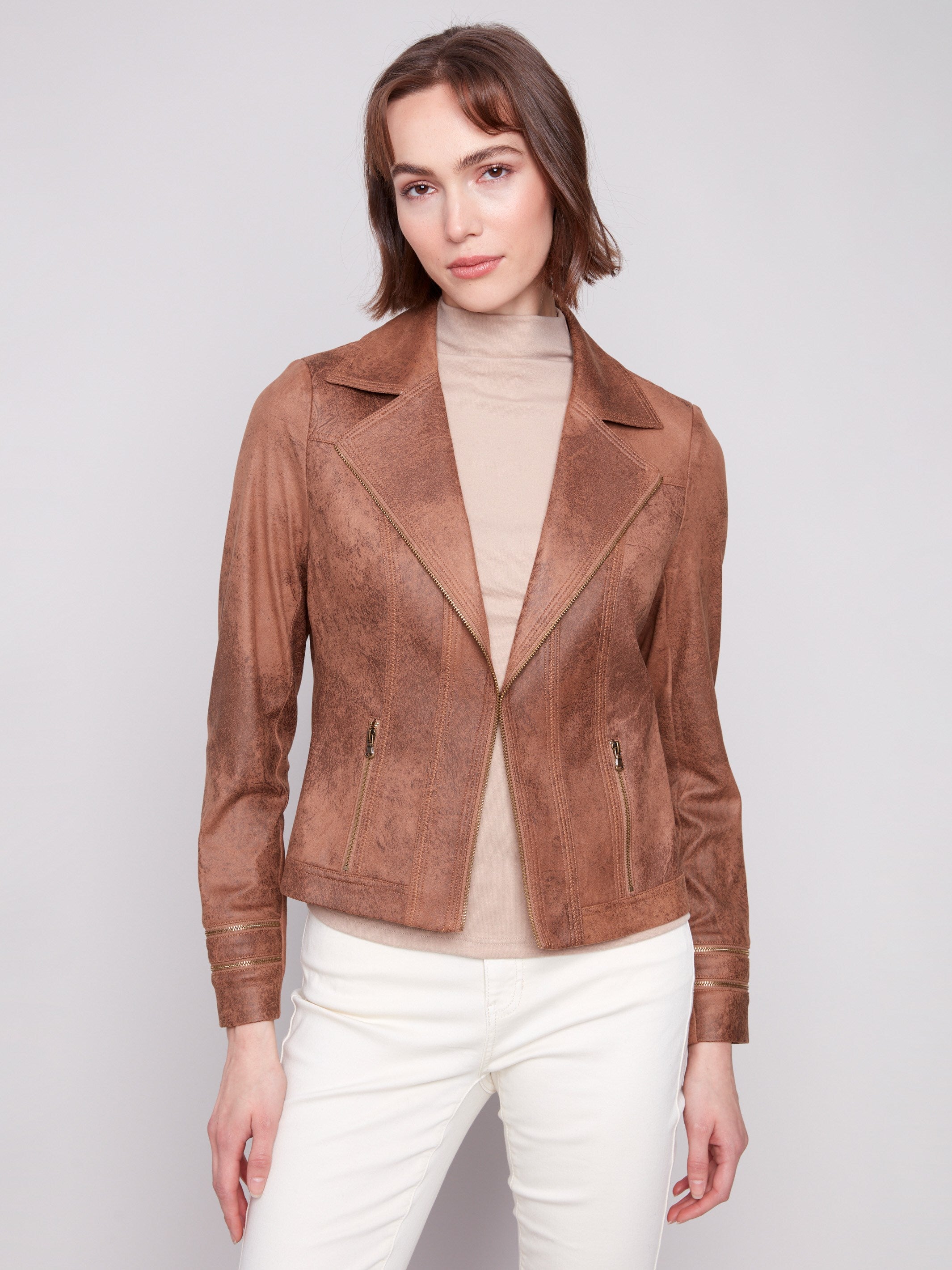 Chic truffle faux leather jacket designed with exquisite zipper features and a contemporary lapel collar by Charlie B.