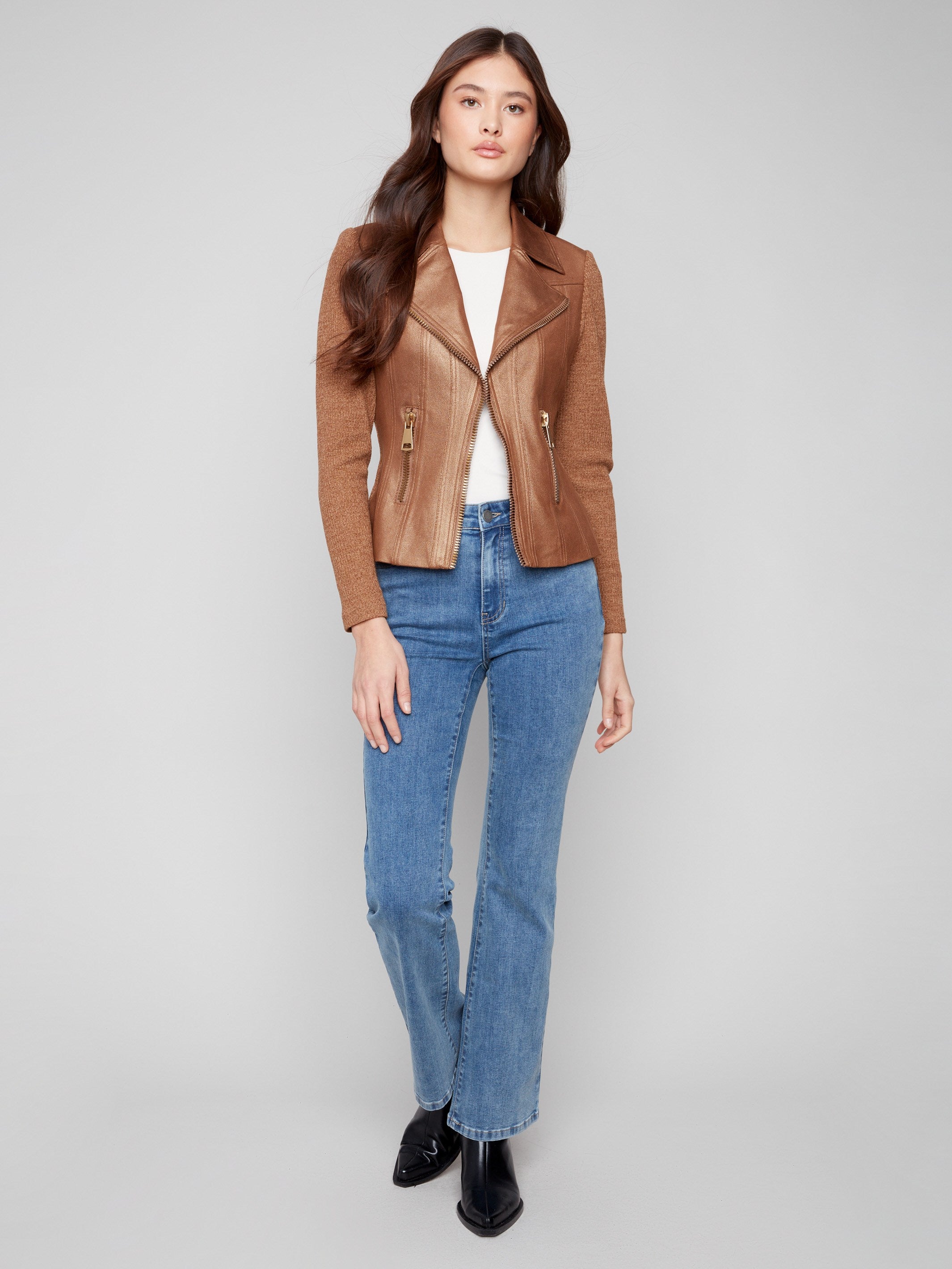 This faux leather jacket features a sleek hook-and-eye closure, adding elegance to any outfit by Charlie B.