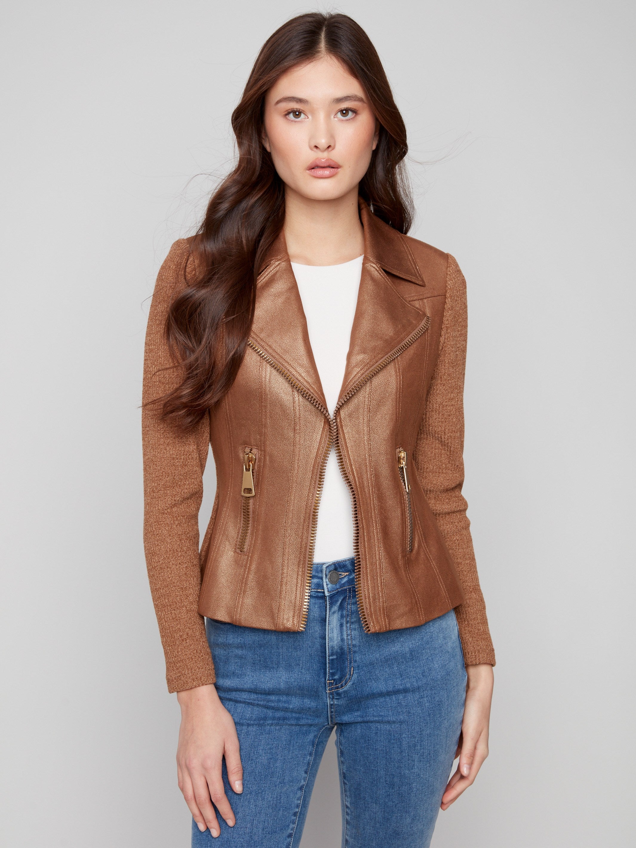 A trendy copper jacket with faux pockets and zippers, combining practicality and style by Charlie B.