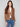 A trendy copper jacket with faux pockets and zippers, combining practicality and style by Charlie B.
