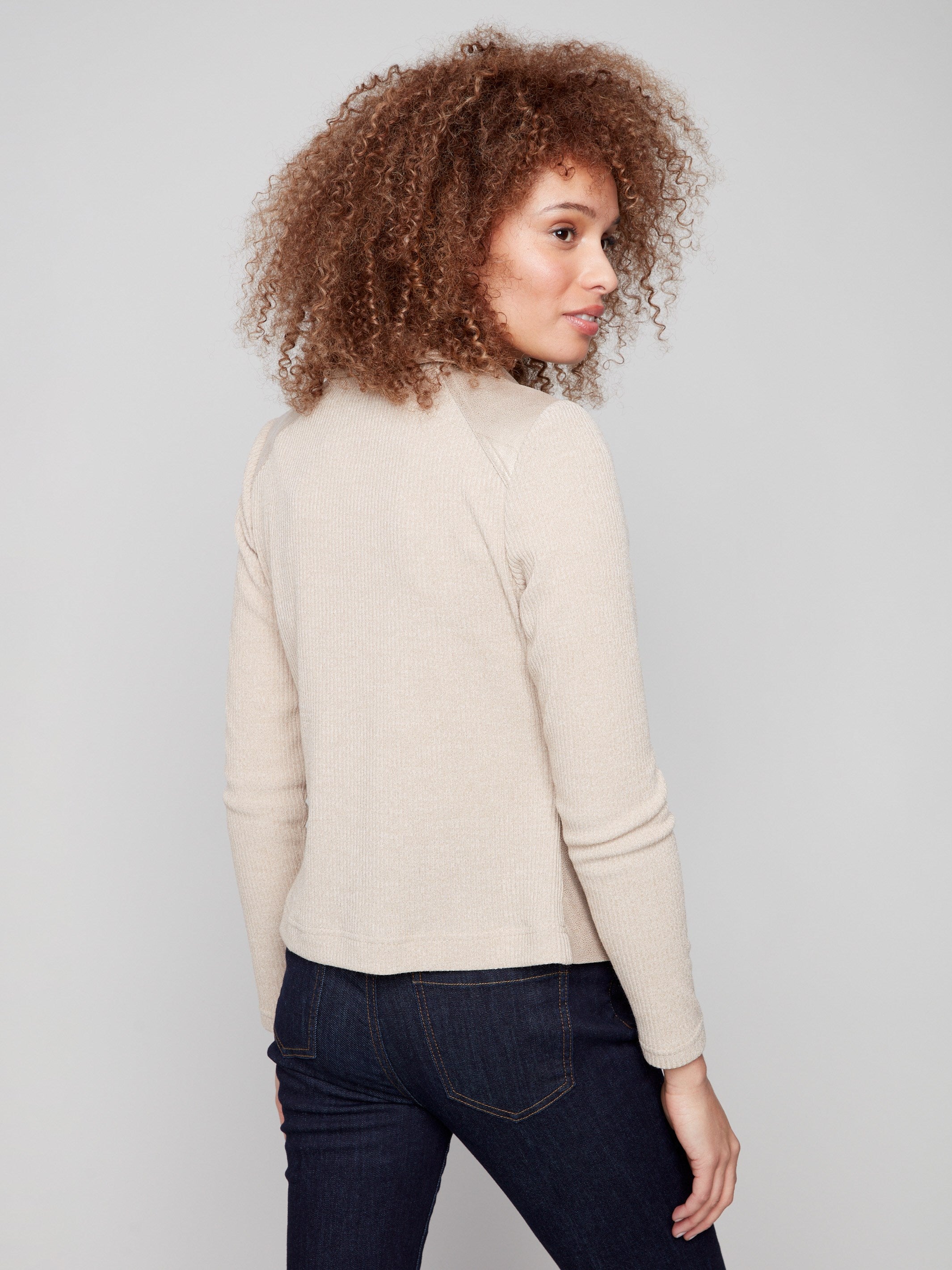 Stylish brass jacket showcasing rib knit sleeves and back, adding texture to the look by Charlie B.