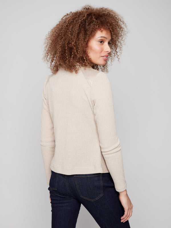 Stylish brass jacket showcasing rib knit sleeves and back, adding texture to the look by Charlie B.
