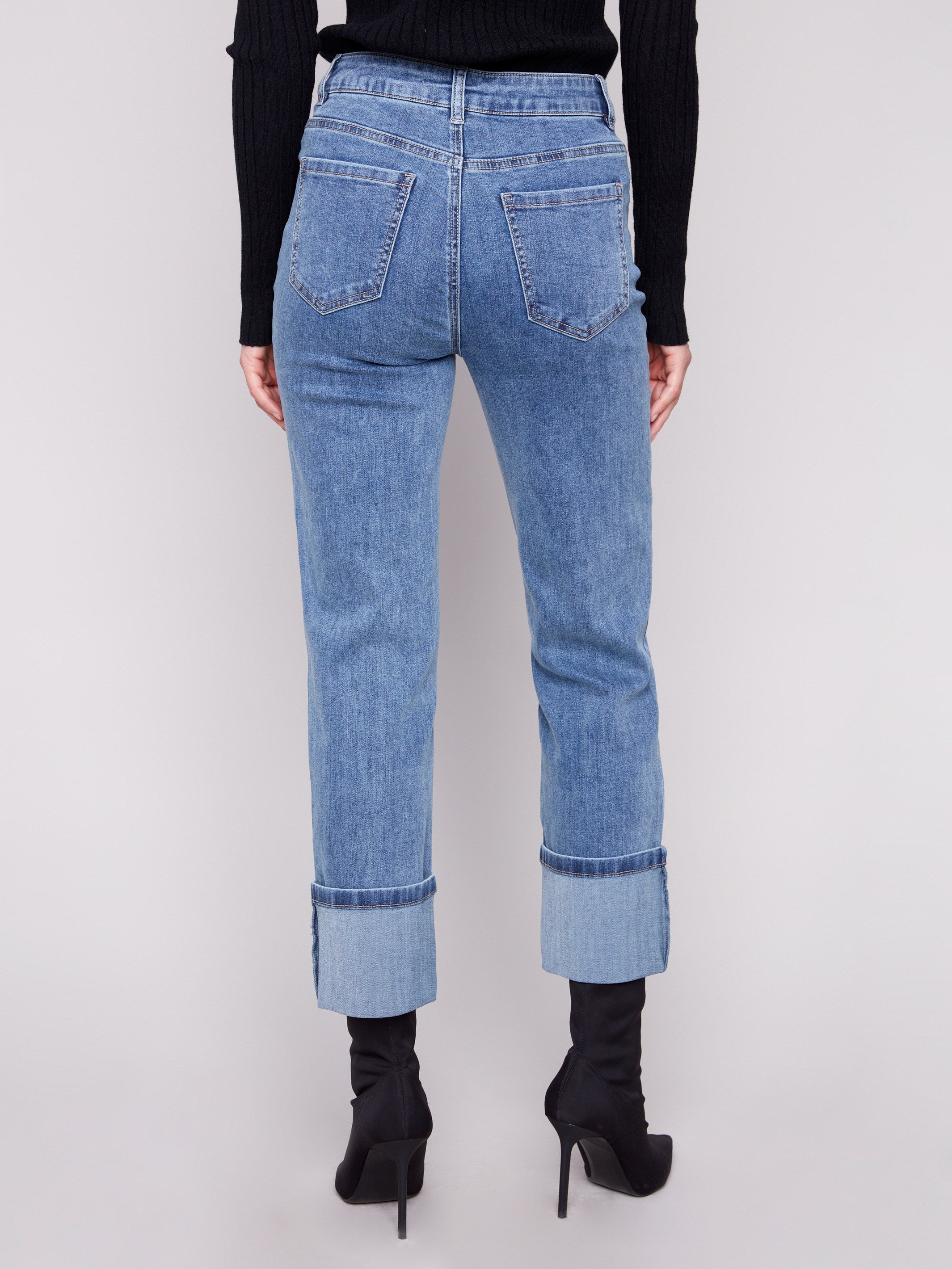 Classic five-pocket design in medium blue denim with regular rise and wide cuffs, perfect for casual outings by Charlie B.