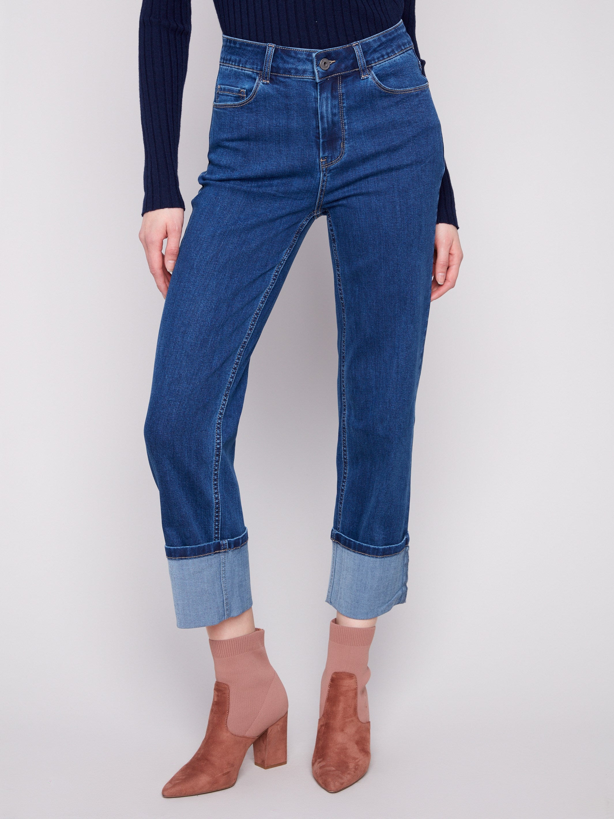 Cropped length indigo jeans featuring a five-pocket design and regular rise for versatile styling by Charlie B.